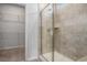 Bathroom featuring glass shower and a walk-in closet at 8761 Nw Nashville Dr., Calabash, NC 28467