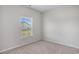 Cozy bedroom with carpet flooring and a window providing natural light at 8761 Nw Nashville Dr., Calabash, NC 28467
