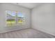 Cozy bedroom with carpet flooring and a window providing natural light at 8761 Nw Nashville Dr., Calabash, NC 28467