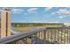 Picturesque view from the balcony featuring a river and marsh landscape on a sunny day at 9550 Shore Dr. # 1418, Myrtle Beach, SC 29572
