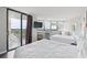 Cozy bedroom with two beds, a TV, and a sliding door to a balcony with a view at 9550 Shore Dr. # 1418, Myrtle Beach, SC 29572