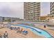 A fun lazy river and pool with lounge chairs are right outside your hotel room at 9550 Shore Dr. # 1418, Myrtle Beach, SC 29572