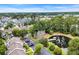 Stunning aerial view of community with a pond and mature trees at 97 Shadow Moss Pl. # 97, North Myrtle Beach, SC 29582