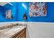 Stylish powder room with blue walls, and marble countertop at 97 Shadow Moss Pl. # 97, North Myrtle Beach, SC 29582