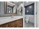 Bathroom with a large vanity, framed mirror and a toilet behind an open door at 97 Shadow Moss Pl. # 97, North Myrtle Beach, SC 29582
