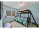 Bright bedroom features a bunk bed, large window, and soft blue walls at 97 Shadow Moss Pl. # 97, North Myrtle Beach, SC 29582