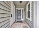 Inviting entryway with decorative tile flooring, storm door and convenient coat storage at 97 Shadow Moss Pl. # 97, North Myrtle Beach, SC 29582