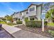 Charming two-story townhome with manicured landscaping and visitor parking in a coastal community at 97 Shadow Moss Pl. # 97, North Myrtle Beach, SC 29582