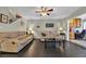 Spacious living room with comfortable seating, tile flooring, and staircase access at 97 Shadow Moss Pl. # 97, North Myrtle Beach, SC 29582