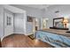 This main bedroom has wood floors, ensuite bathroom, and a walk in closet at 97 Shadow Moss Pl. # 97, North Myrtle Beach, SC 29582