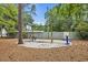 playground featuring a swing set and basketball hoop at 97 Shadow Moss Pl. # 97, North Myrtle Beach, SC 29582