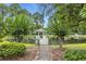 A serene pond with a charming gazebo, surrounded by lush trees and greenery for a relaxing outdoor experience at 97 Shadow Moss Pl. # 97, North Myrtle Beach, SC 29582