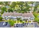 An aerial view of townhomes with a well-maintained parking lot, landscaping, and patio areas at 97 Shadow Moss Pl. # 97, North Myrtle Beach, SC 29582