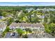 An aerial shot of the townhomes displaying the manicured lawns, parking, and beautiful trees around the property at 97 Shadow Moss Pl. # 97, North Myrtle Beach, SC 29582