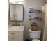 Neutral bathroom with a sleek sink, floating shelves, and modern fixtures at 10200 Lake Shore Dr. # 4, Myrtle Beach, SC 29572