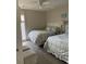 Inviting bedroom with two beds, a ceiling fan, and natural light at 10200 Lake Shore Dr. # 4, Myrtle Beach, SC 29572