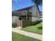 Exterior view of a condo building, showcasing the private patio with brick privacy wall at 10200 Lake Shore Dr. # 4, Myrtle Beach, SC 29572