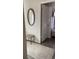 Hallway featuring a mirror, bench, and access to the bedroom at 10200 Lake Shore Dr. # 4, Myrtle Beach, SC 29572
