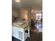 Bright kitchen with white cabinetry, an island, and an open view to the dining area at 10200 Lake Shore Dr. # 4, Myrtle Beach, SC 29572