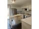 Bright kitchen featuring stainless appliances, an island, and light-colored cabinets at 10200 Lake Shore Dr. # 4, Myrtle Beach, SC 29572