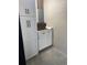 Bright laundry area with white cabinets, sleek hardware, and a practical countertop for folding at 10200 Lake Shore Dr. # 4, Myrtle Beach, SC 29572