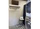 Laundry area featuring a washer and dryer, plus storage shelf at 10200 Lake Shore Dr. # 4, Myrtle Beach, SC 29572