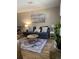 Cozy living room with a stylish sofa, patterned rug, and beach-themed art at 10200 Lake Shore Dr. # 4, Myrtle Beach, SC 29572