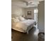 Serene main bedroom featuring a comfortable bed, ceiling fan, and natural light at 10200 Lake Shore Dr. # 4, Myrtle Beach, SC 29572