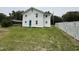 View of the backyard with a white fence and the rear exterior of the home at 1022 Holt Rd., Conway, SC 29526