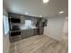 Contemporary kitchen showcasing stainless steel appliances and gray cabinets at 1022 Holt Rd., Conway, SC 29526