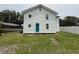 Rear of a two-story white home with a turquoise door and a fenced-in yard at 1022 Holt Rd., Conway, SC 29526
