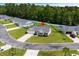 Aerial view of a single-story home with a large yard and driveway on a cul-de-sac at 104 Browns Hollow Ct., Loris, SC 29569