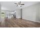 Open concept living room and kitchen with wood flooring and stainless steel appliances at 104 Browns Hollow Ct., Loris, SC 29569