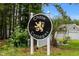 Entrance sign for Chase Cottages community featuring lush landscaping and a welcoming atmosphere at 104 Browns Hollow Ct., Loris, SC 29569