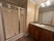 Bathroom with glass enclosed shower, oak vanity, and modern sink fixtures at 1041 Morning Dale St., Conway, SC 29526