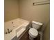 Bathroom featuring a jacuzzi tub, toilet, and modern fixtures at 1041 Morning Dale St., Conway, SC 29526