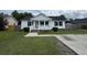Charming one-story home with white siding, a cozy front porch, and a well-maintained lawn at 1041 Morning Dale St., Conway, SC 29526