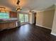 Well-lit kitchen with wooden cabinets, stainless steel appliances, and windows above the sink at 1041 Morning Dale St., Conway, SC 29526