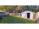 Well-maintained backyard with storage shed and manicured lawn surrounded by mature trees and fencing at 1089 Weslin Creek Dr., Myrtle Beach, SC 29588