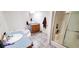 Bright bathroom features a soaking tub, vanity with storage, and tiled flooring at 1089 Weslin Creek Dr., Myrtle Beach, SC 29588