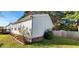 The exterior view displays the side of a vinyl-sided home with tidy landscaping and a brick foundation at 1089 Weslin Creek Dr., Myrtle Beach, SC 29588