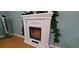 Close up view of a decorative white electric fireplace at 1089 Weslin Creek Dr., Myrtle Beach, SC 29588