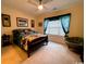 Comfortable bedroom with a queen-size bed, decorative pillows, and a window with natural light at 1101 Peace Pipe Pl. # 104, Myrtle Beach, SC 29579