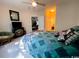 Comfortable bedroom featuring a plush quilt, ceiling fan, and adjacent bathroom access at 1101 Peace Pipe Pl. # 104, Myrtle Beach, SC 29579