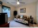 Cozy bedroom features a neutral palette, ceiling fan, and comfortable furnishings for a relaxing atmosphere at 1101 Peace Pipe Pl. # 104, Myrtle Beach, SC 29579
