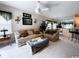 Spacious living room with comfortable seating, a ceiling fan, and a view into the dining area at 1101 Peace Pipe Pl. # 104, Myrtle Beach, SC 29579