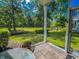 Relaxing screened-in patio offers serene views of the lush green surroundings and a tranquil creek at 1101 Peace Pipe Pl. # 104, Myrtle Beach, SC 29579