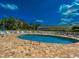 Inviting outdoor pool surrounded by a brick deck and a white fence, perfect for summertime relaxation and enjoyment at 1101 Peace Pipe Pl. # 104, Myrtle Beach, SC 29579