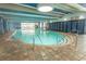 Bright indoor pool area with lounge chairs, seating, and unique architecture with pops of blue at 1105 S Ocean Blvd. # 932, Myrtle Beach, SC 29577
