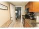 Updated kitchen features stainless appliances, wood cabinets and granite countertops at 1105 S Ocean Blvd. # 932, Myrtle Beach, SC 29577